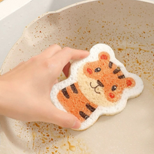Load image into Gallery viewer, Person using a tiger design sponge to clean a dirty cooking pan
